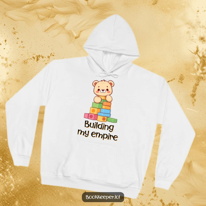 Funny Bear Cub Hoodie: Adorable character meticulously stacking colorful blocks into a tall tower, perfect for a cozy and humorous look.